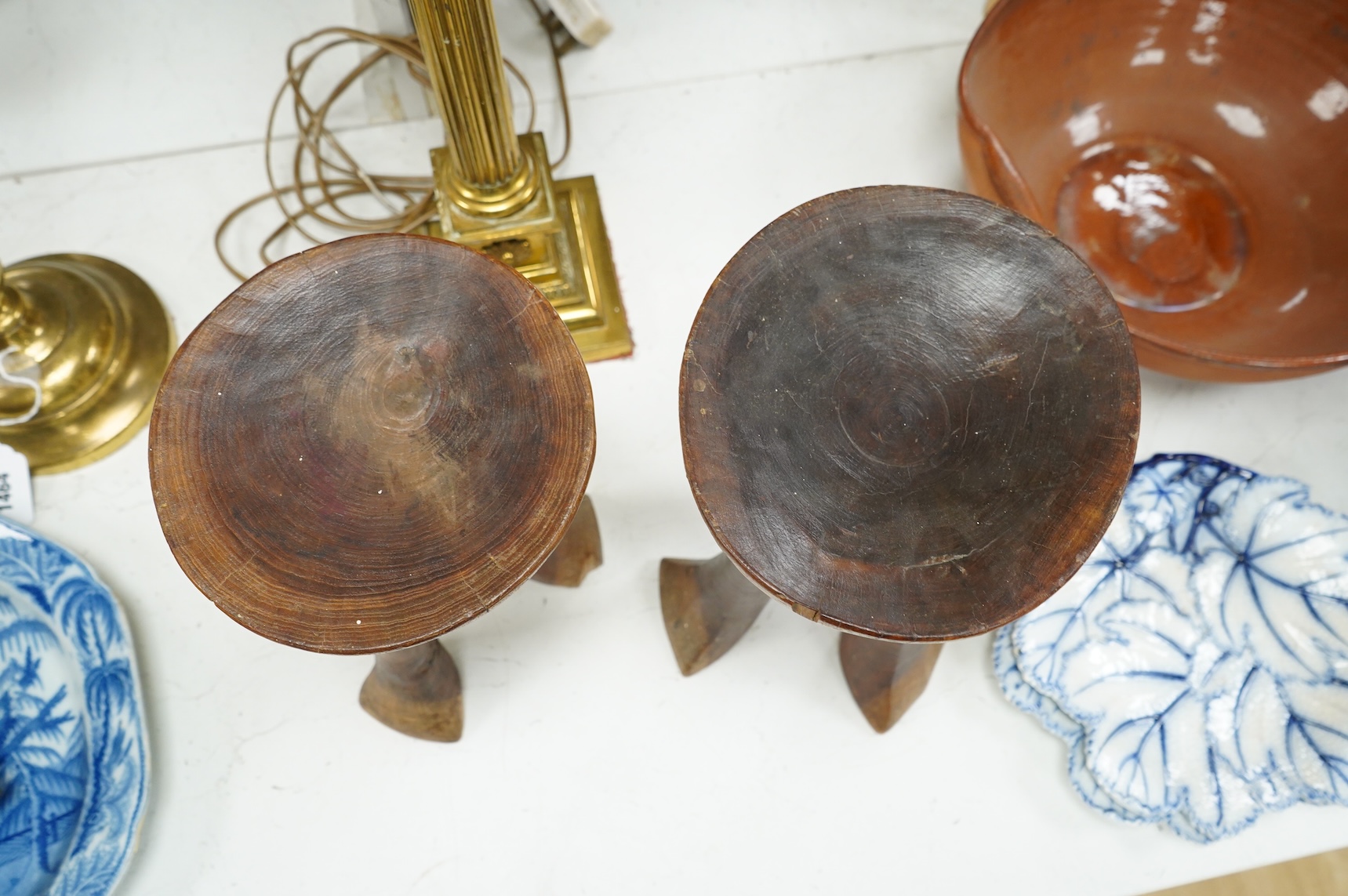 Two African tribal carved hardwood three-legged stools, tallest 28.5cm